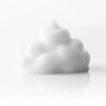White styling and finishing mousse displayed on a white background